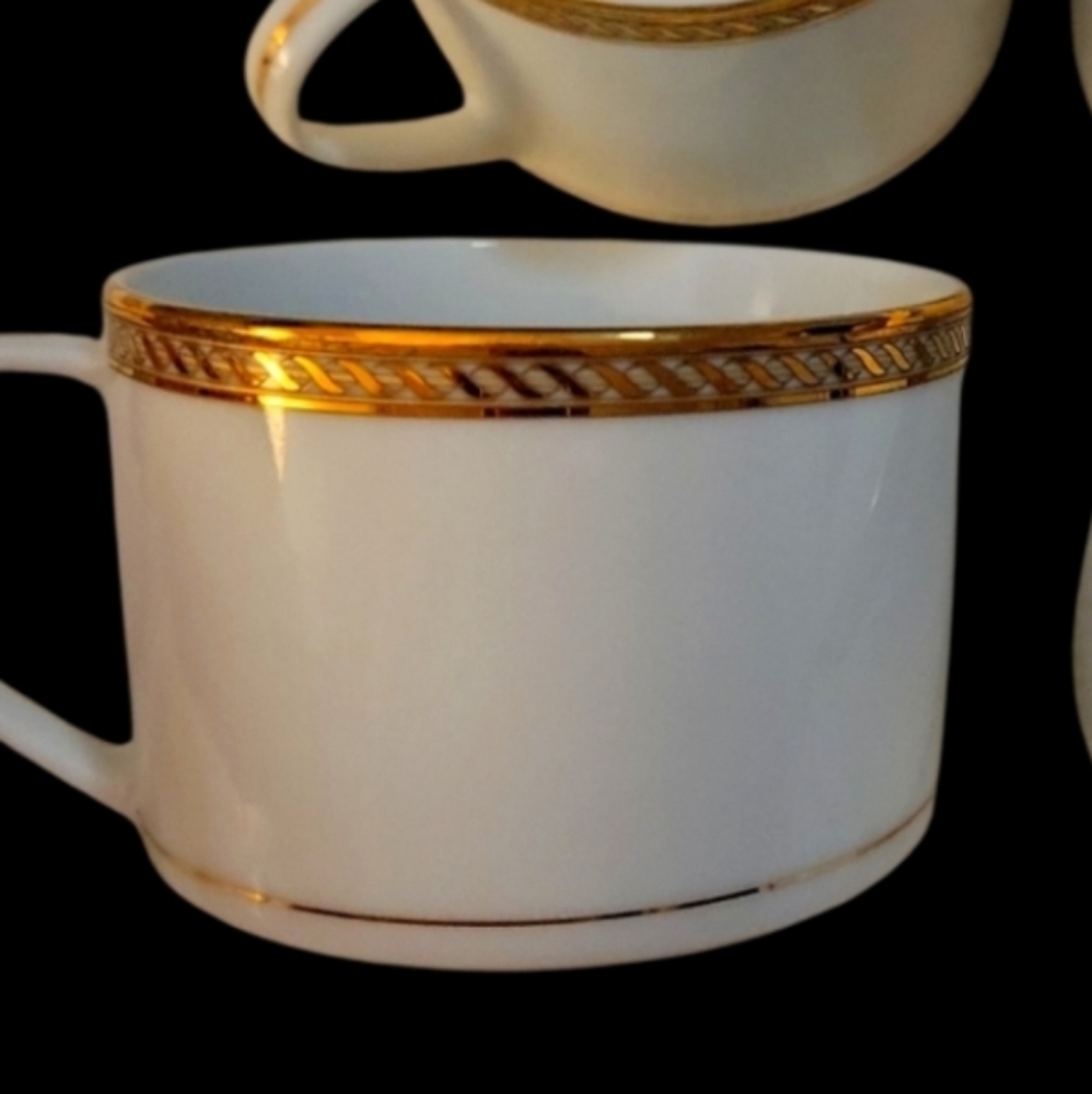 One Elegant Gold Rimmed White Tea Cup